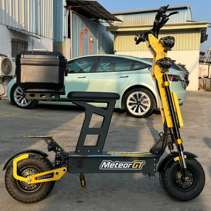 Yellow and black electric scooter with 'Meteor GT' branding in front of a car.