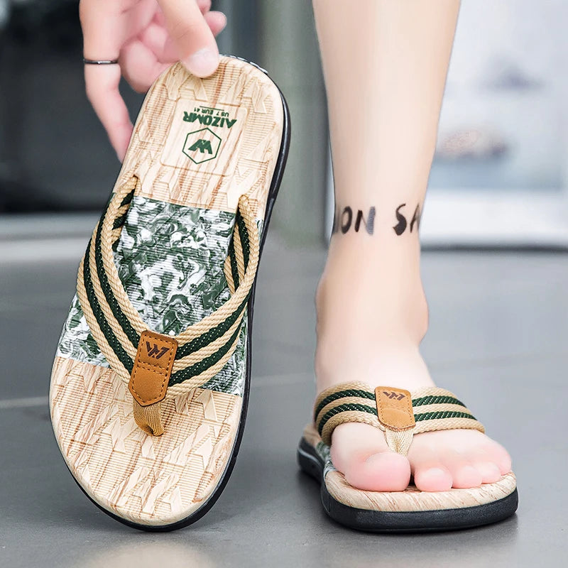Person wearing a sandal with a brand logo on a neutral background