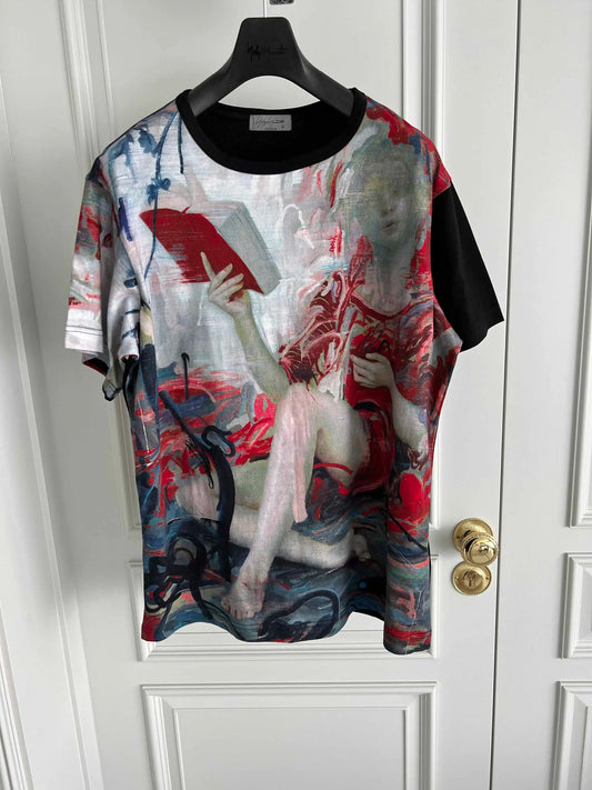 Artistic t-shirt with a graphic design on a hanger against a white door.