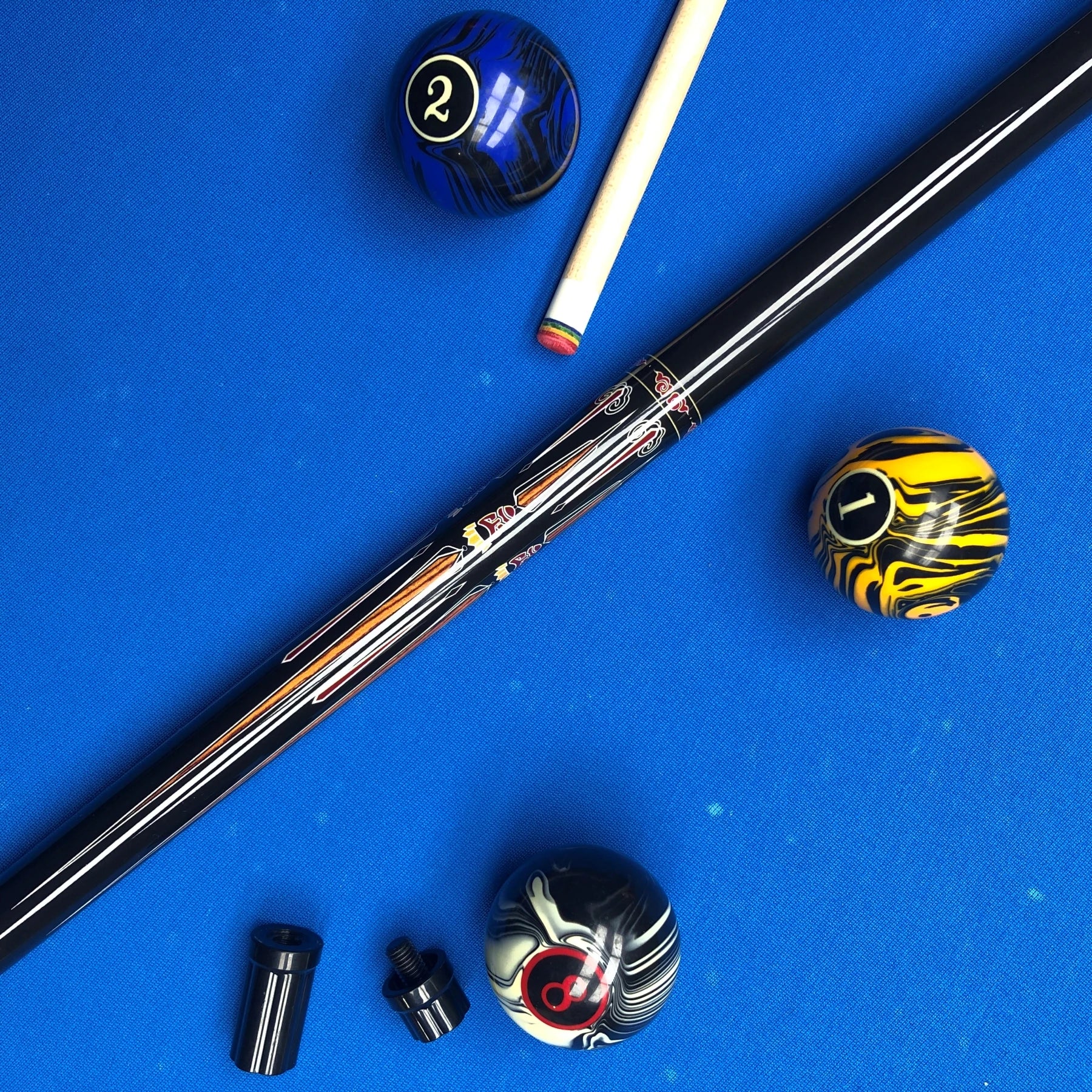 Pool cue and balls on a blue felt surface