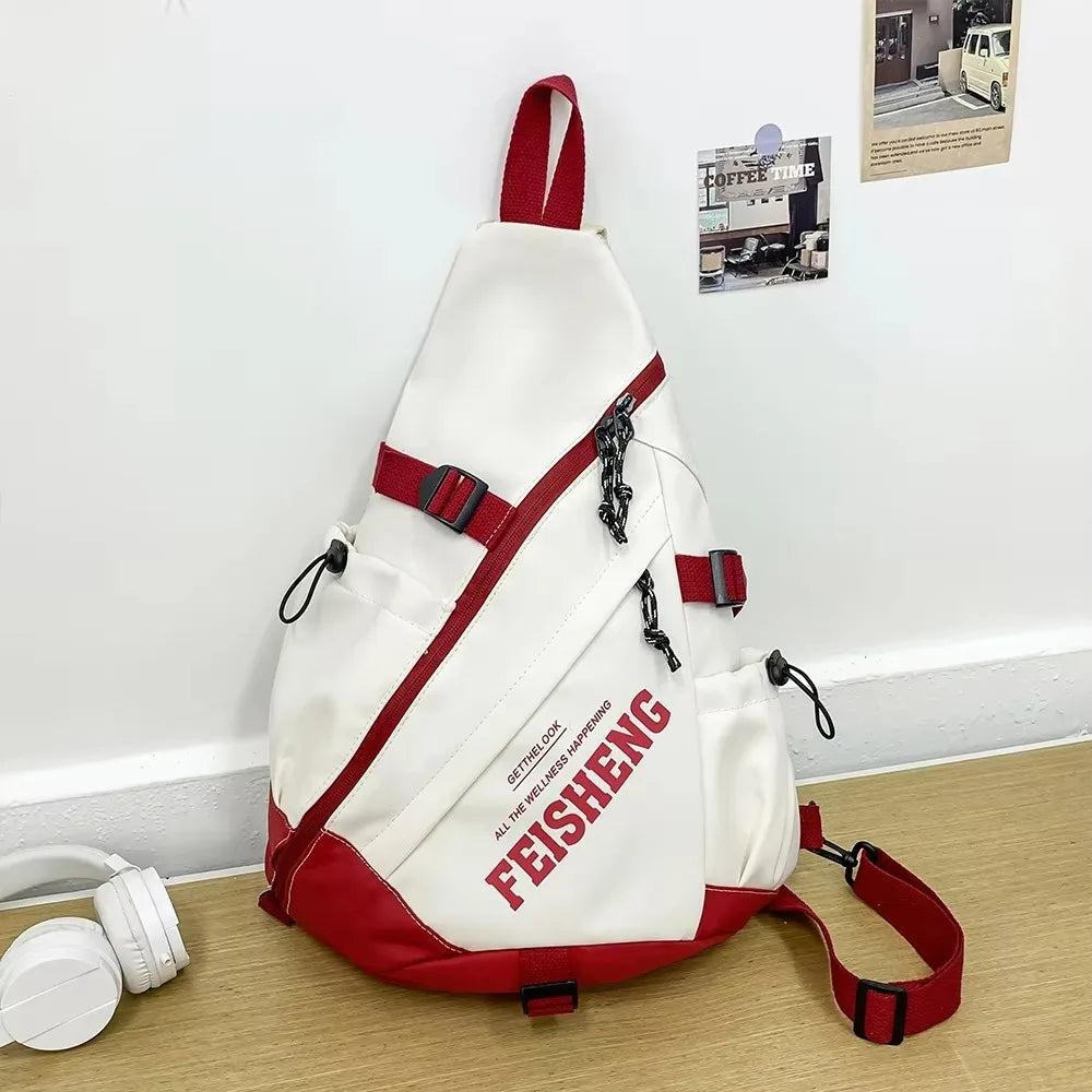 White and red sling bag with 'FEISHENG' branding on a wooden floor.