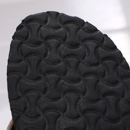 Close-up of a textured black sole on a white background