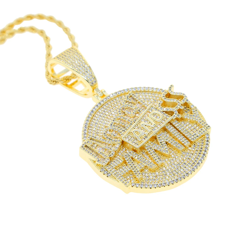 Gold pendant with intricate design on a white background