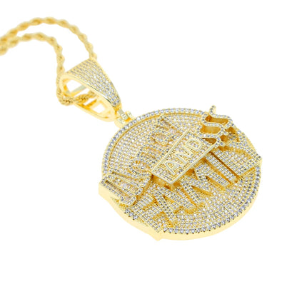Gold pendant with intricate design on a white background