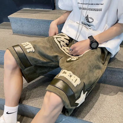Person wearing camouflage shorts with brand logos sitting on a staircase.
