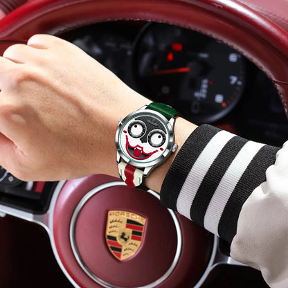 Person wearing a watch with a unique design in front of a Porsche car interior.
