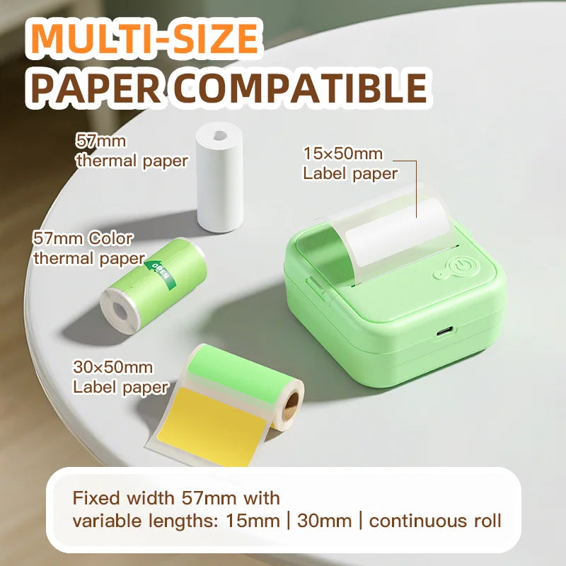 Green paper roll dispenser with various paper sizes on a white surface