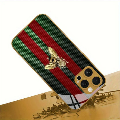 Phone case with red and green stripes and a bee emblem on a gold surface