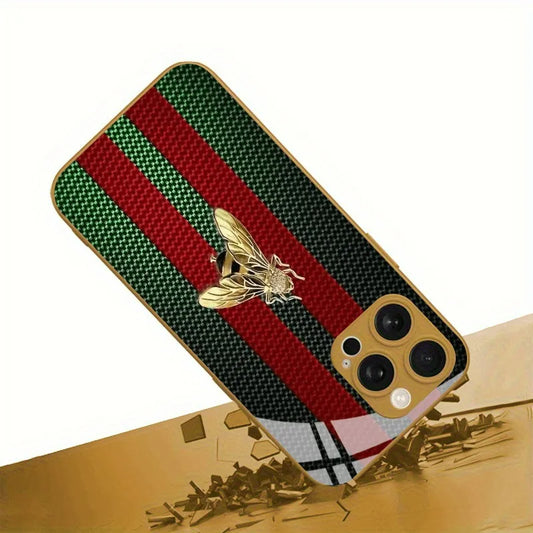 Phone case with red and green stripes and a bee emblem on a gold surface