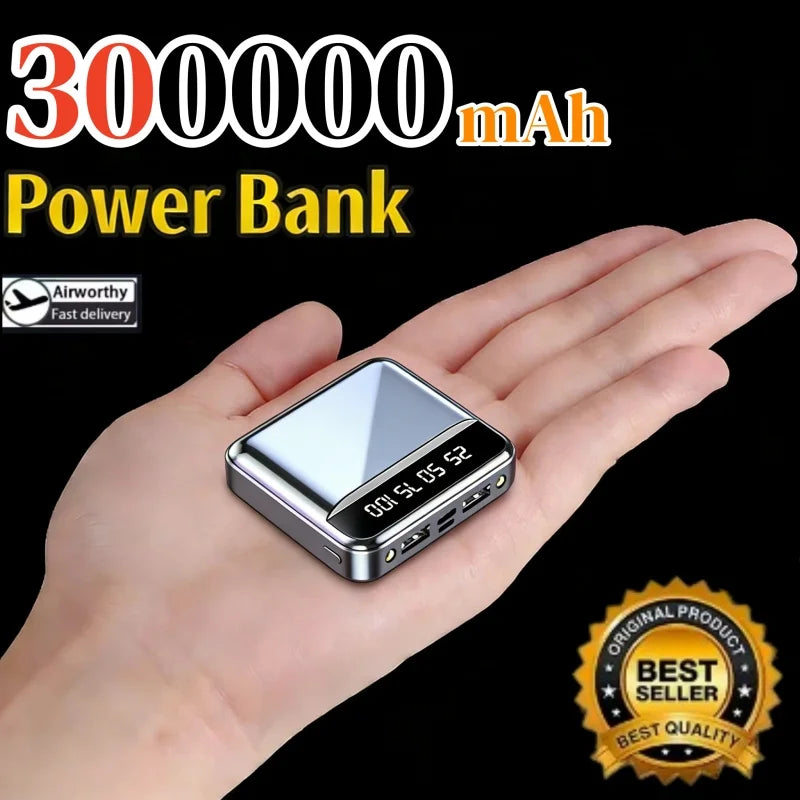 Power bank with 300000mAh capacity held in a hand, on a black background.