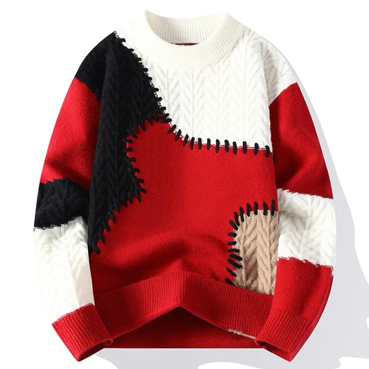 Color-blocked sweater with red, black, and white sections on a white background