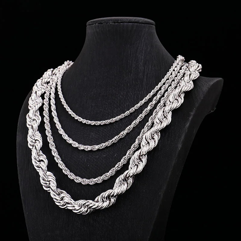 Three silver rope chains on a black mannequin bust