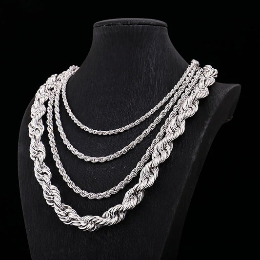 Three silver rope chains on a black mannequin bust