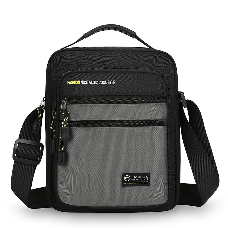 Black and gray crossbody bag with visible branding on a white background