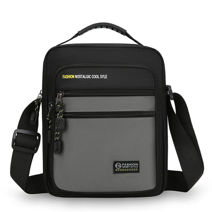 Black and gray crossbody bag with visible branding on a white background