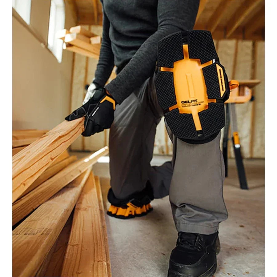 Person in a workshop wearing a tool belt with a DeWalt tool, holding wooden planks.