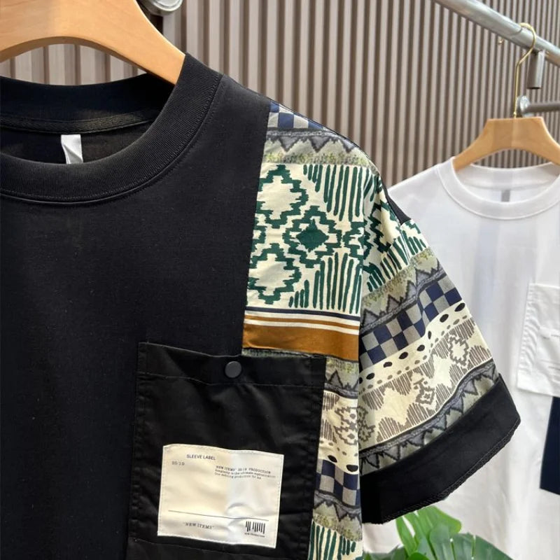 Black shirt with geometric patterned sleeves on a hanger