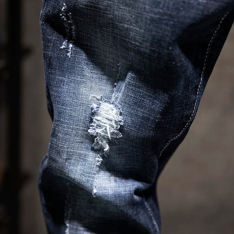 Close-up of a distressed denim fabric with a blurred background
