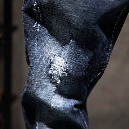 Close-up of a distressed denim fabric with a blurred background
