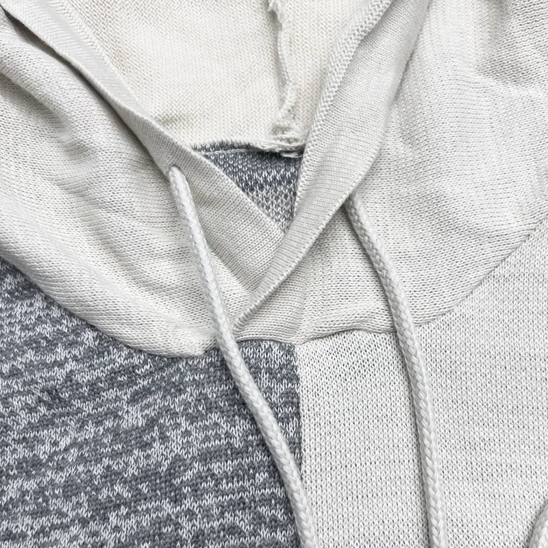 Close-up of a gray hoodie with a hood and drawstring