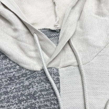 Close-up of a gray hoodie with a hood and drawstring
