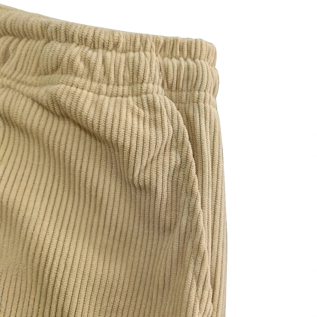 Close-up of beige corduroy pants on a white background