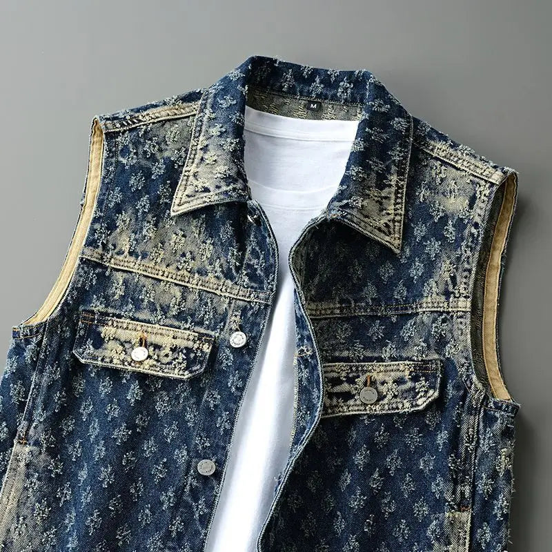 Denim vest with a white shirt underneath on a gray background