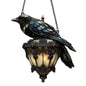 Decorative lamp shaped like a bird with stained glass design on a white background