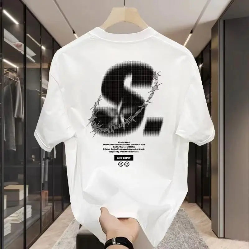 White t-shirt with black graphic design on a hanger in a store setting