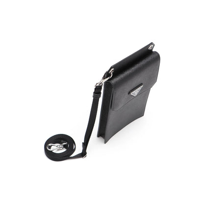 Black leather crossbody bag with a strap on a white background