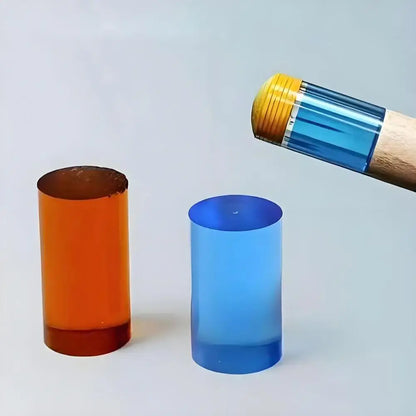 Two colored cylindrical objects and a cylindrical tool on a light gray background