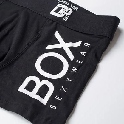 Black boxer briefs with 'Box Sexy Wear' branding on a white background