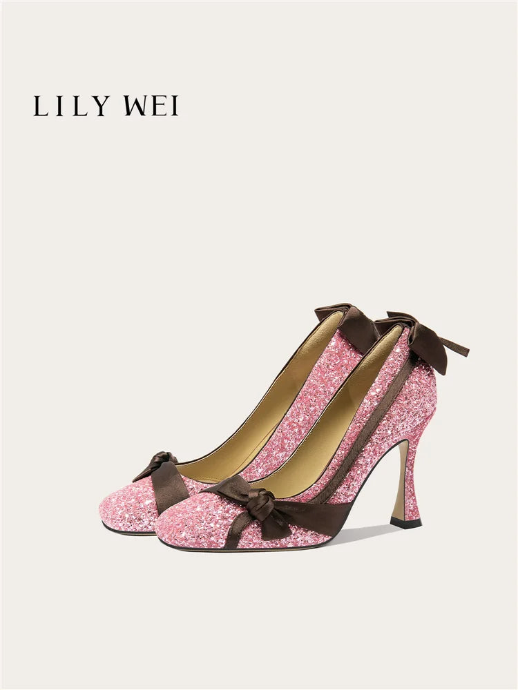 Pink glitter high heels with brown bows on a white background, featuring the brand 'LILY WEI'.