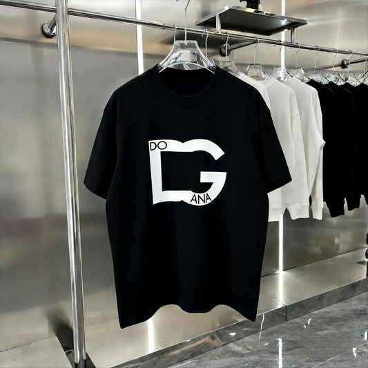 Black t-shirt with a white logo on a hanger in a store setting