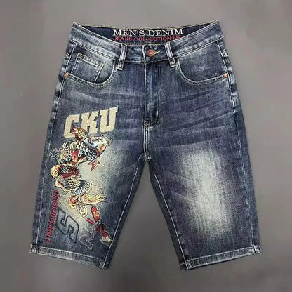Denim shorts with a fish design and 'GKU' branding on a gray background
