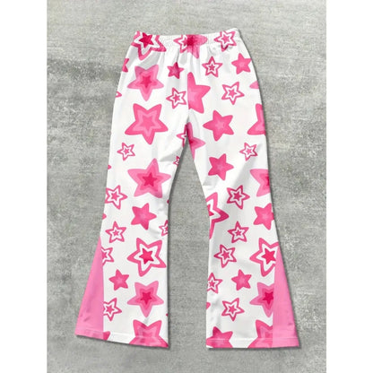 White pants with pink star pattern on a gray surface