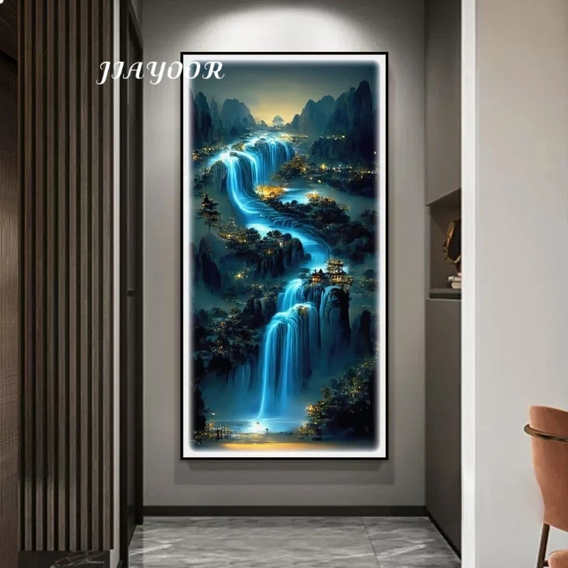 Framed artwork of a mountain landscape with waterfalls in a modern interior setting.
