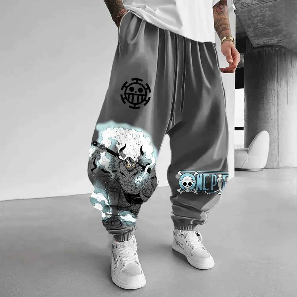 Gray jogger pants with graphic designs and branding on a plain background