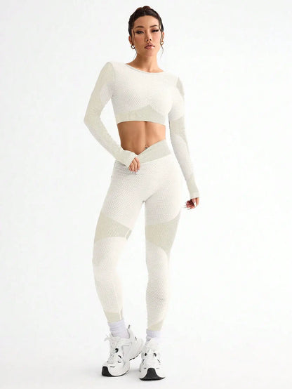 Woman wearing a white athletic outfit on a white background