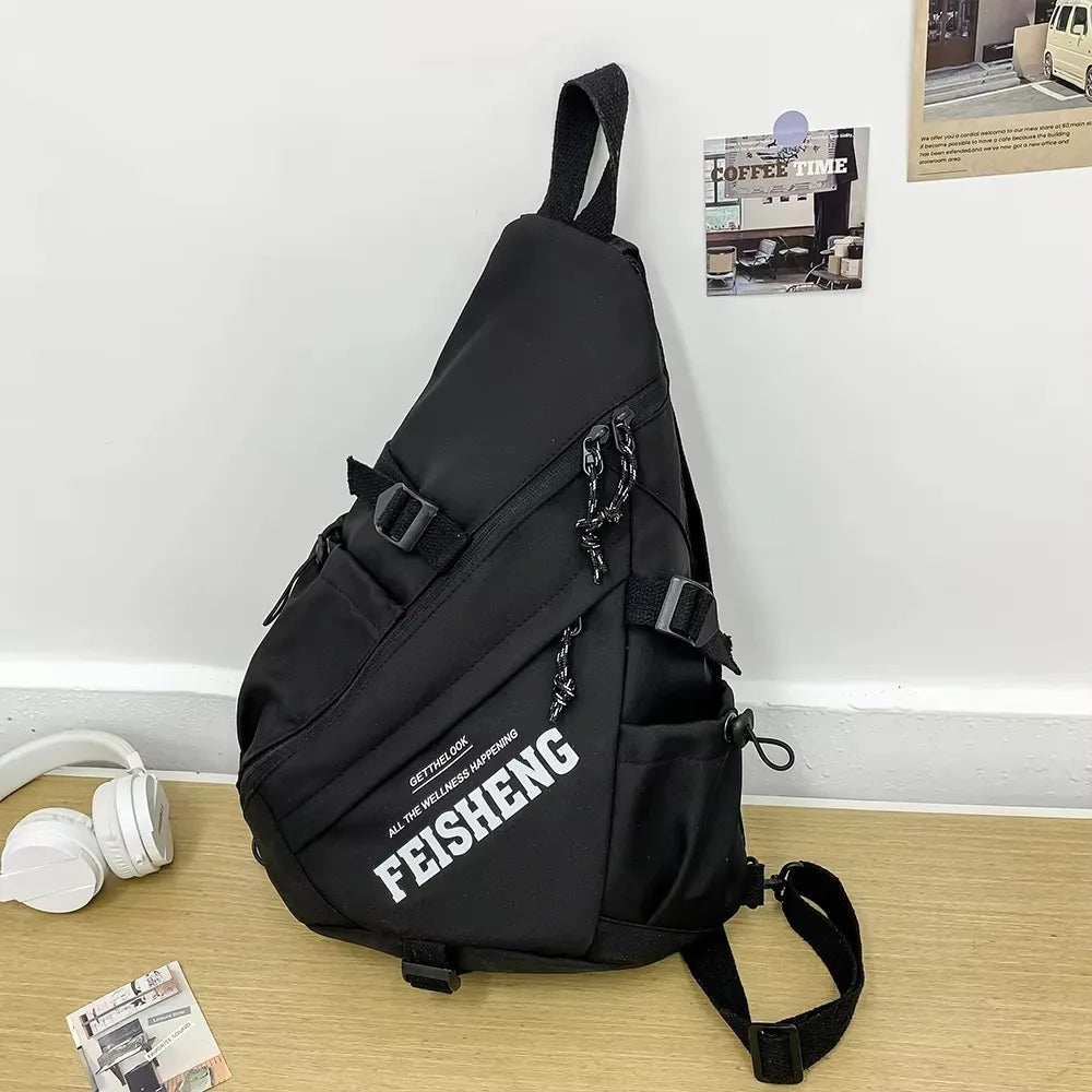 Black sling bag with 'FEISHENG' branding on a wooden surface.