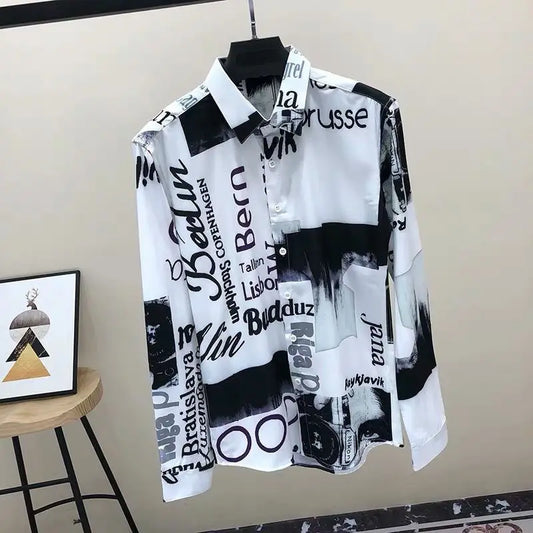 Black and white patterned shirt on a hanger against a beige wall.