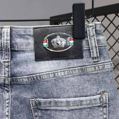 Close-up of a denim product with a brand label on a gray background