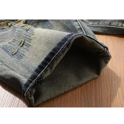 Close-up of a folded pair of jeans on a wooden surface