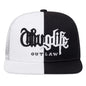Black and white cap with 'Outlaw' text on a white background