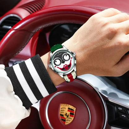 Hand wearing a unique watch with a car's steering wheel in the background