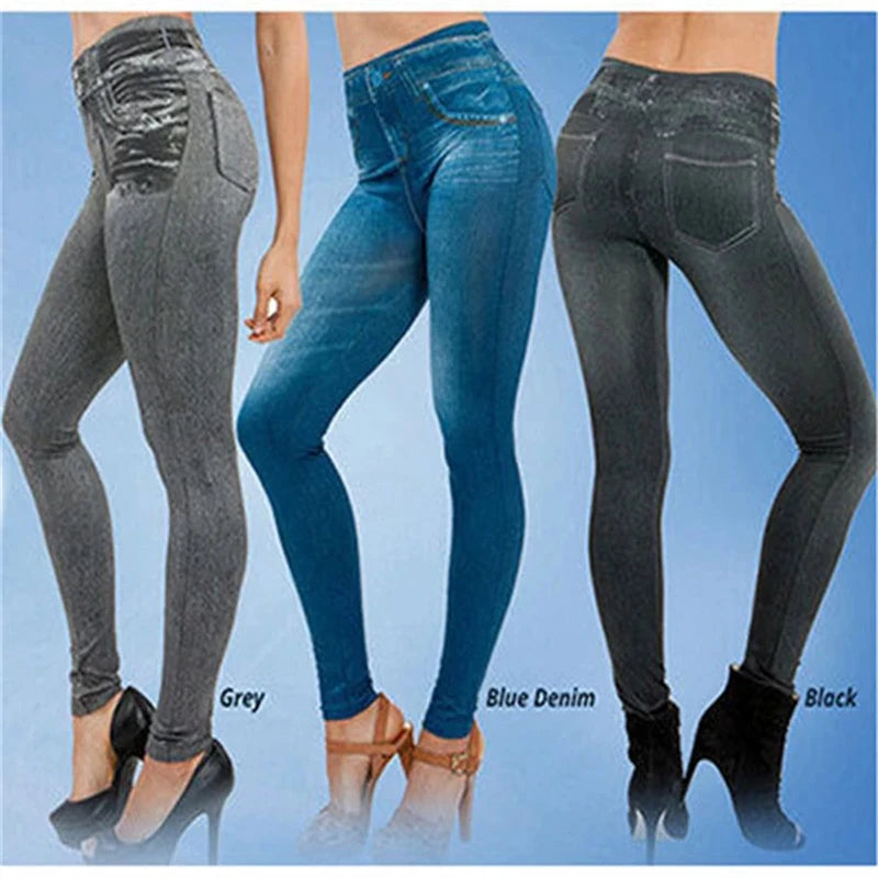 Three pairs of jeans in grey, blue denim, and black on a blue background.