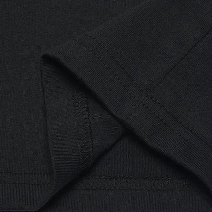 Close-up of black fabric with a visible brand logo.