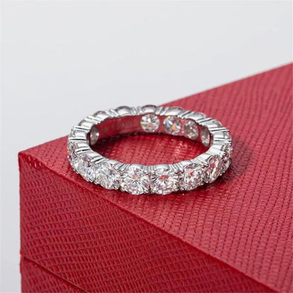 Silver ring with diamonds on a red box