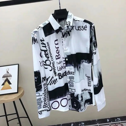 Black and white patterned shirt on a hanger against a beige wall.