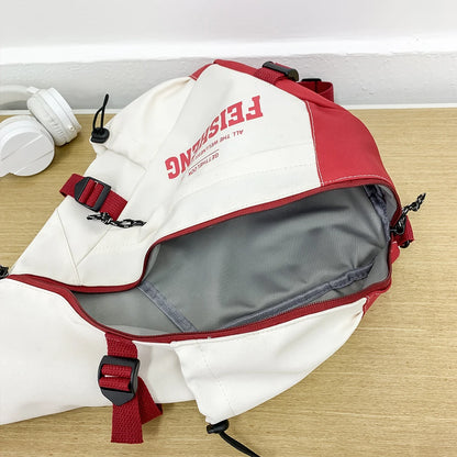 Red and white backpack with visible branding on a wooden surface.